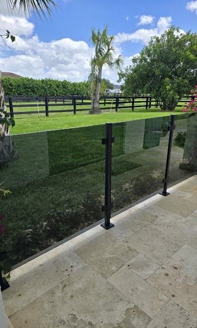 Glass patio railing with black posts