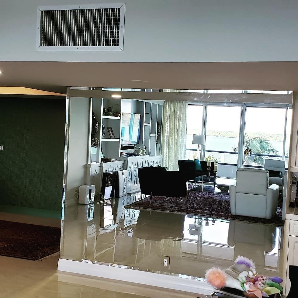 Floor-to-ceiling mirrored wall