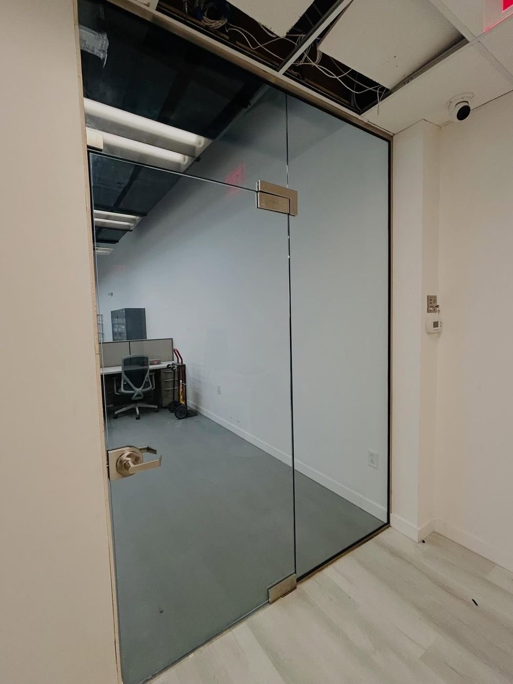 Glass office enclosure with gold channel