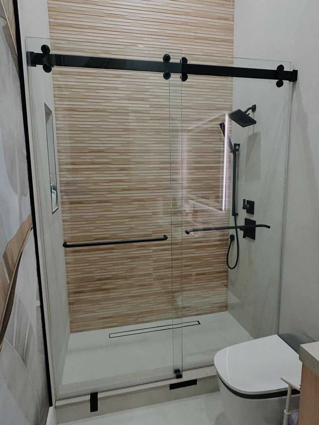 Sliding enclosure with matte black track